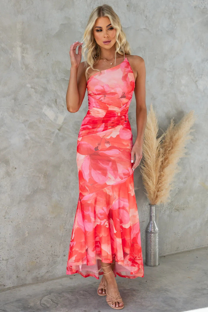 Chic one-shoulder maxi dress for women, featuring a stunning floral print. An elegant choice for wedding guests.