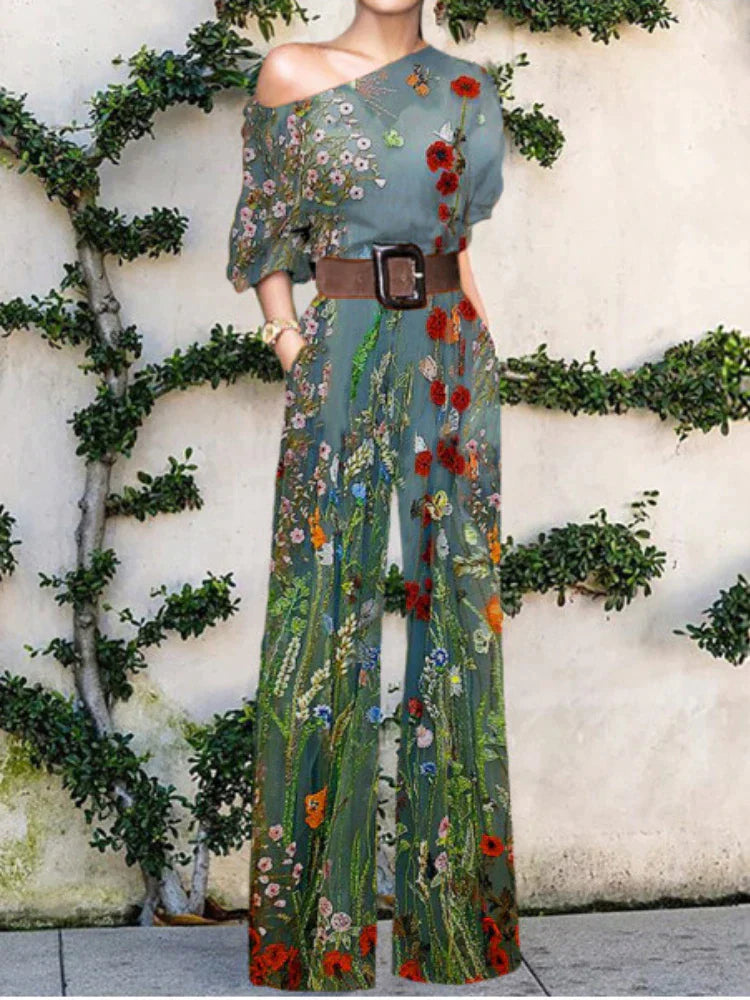 Fashionable women's one-shoulder printed wide-leg jumpsuit, a versatile statement piece for summer or resort.