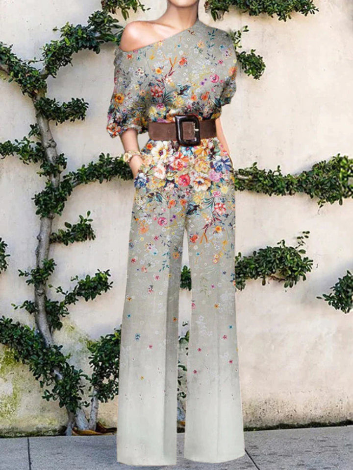 Vibrant printed one-shoulder wide-leg jumpsuit for women, offering a comfortable yet elegant vacation style.