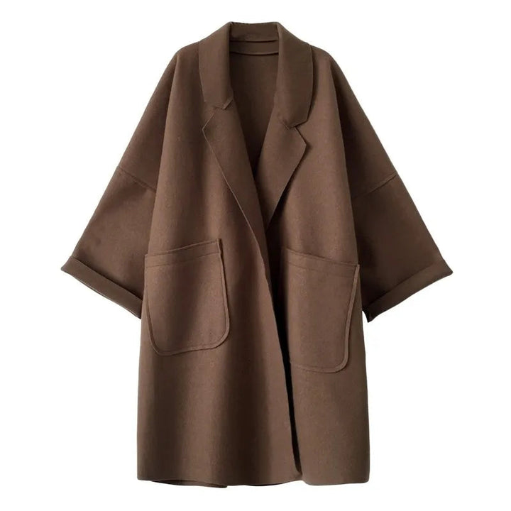 Elegant women's oversized trench coat for business casual. Stylish outerwear, perfect for fall and winter fashion.
