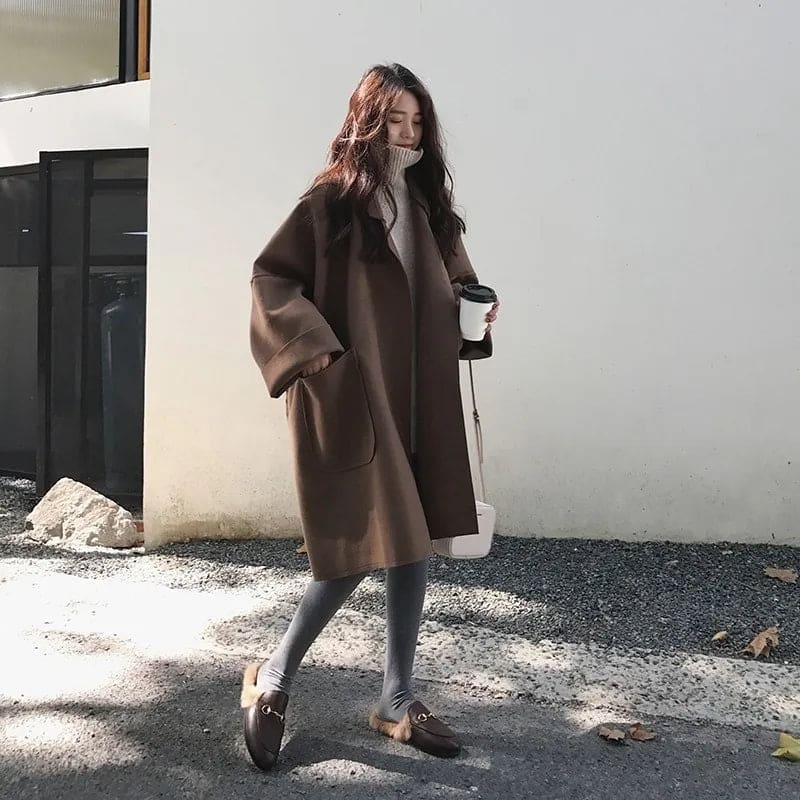 Versatile women's oversized trench coat, a classic long jacket for elegant business and chic casual layering.