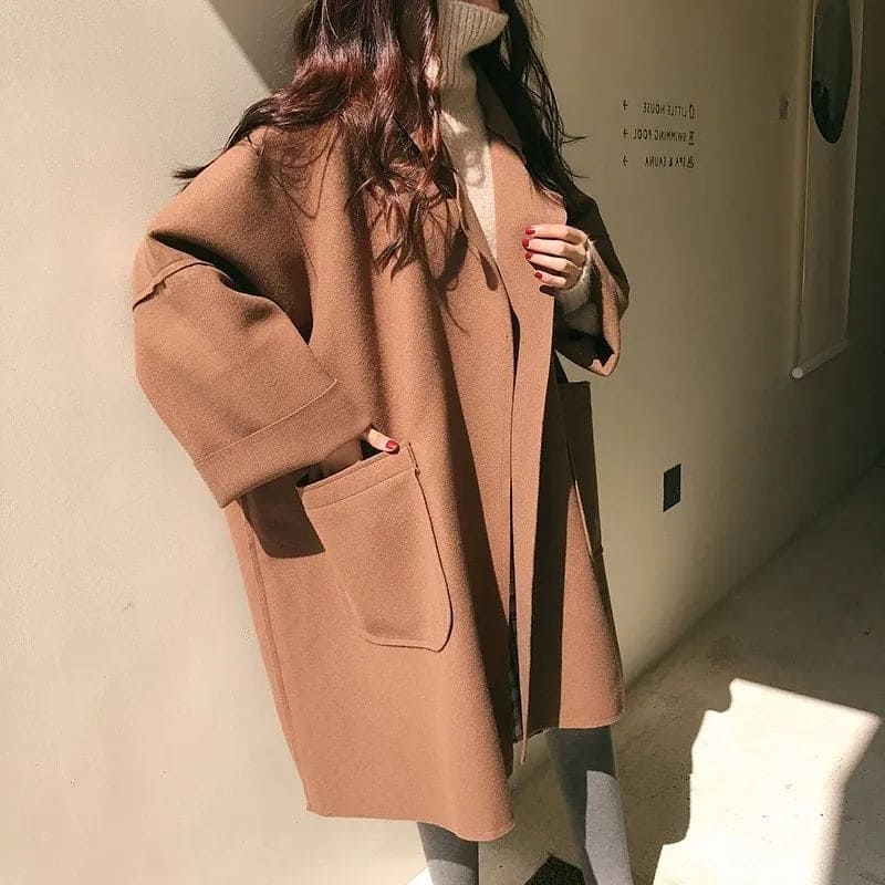 Stylish women's oversized trench coat, an elegant fall fashion essential for business casual outfits.