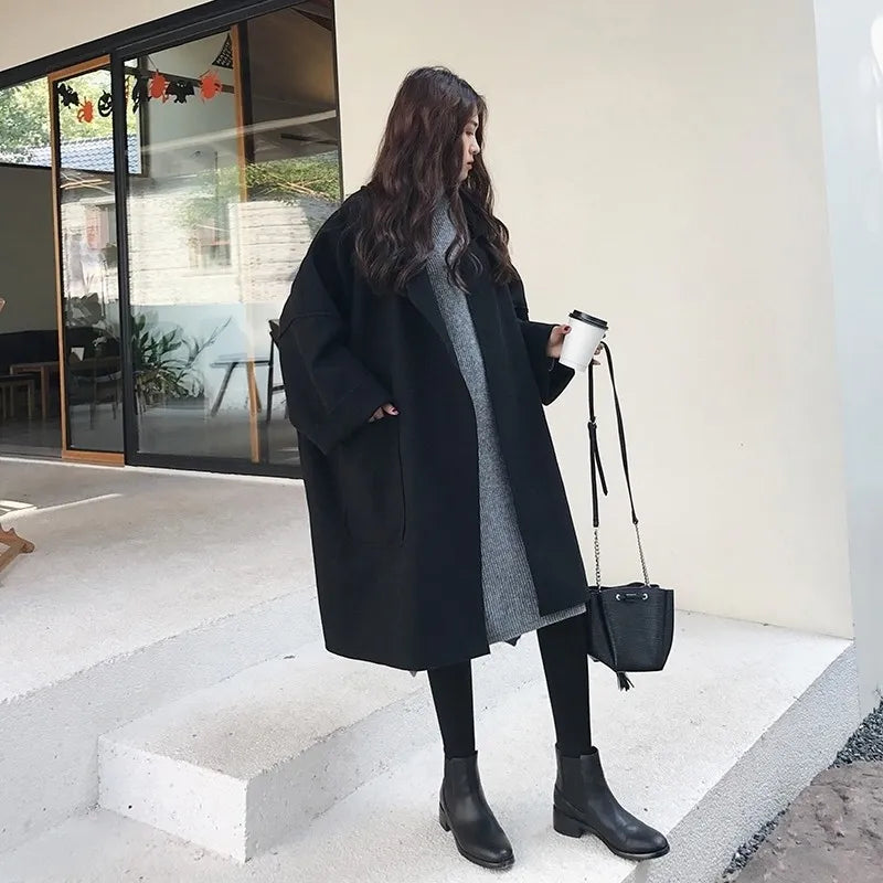Classic women's oversized trench coat, providing an elegant business casual look & stylish fall winter outerwear.