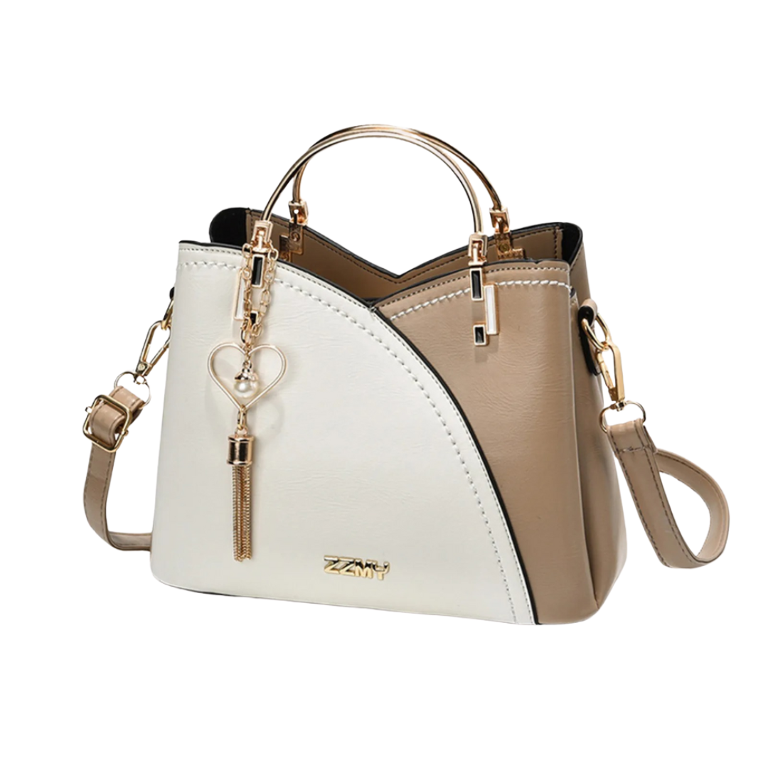 Elegant women's patchwork tote bag with stylish tassel charm. Perfect chic shoulder bag for everyday fashion.