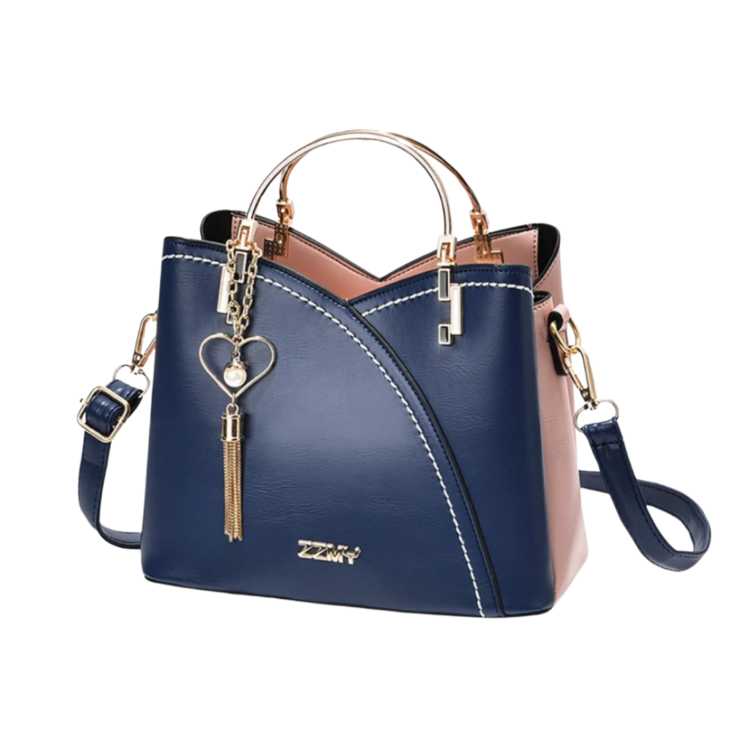 Chic women's patchwork tote bag. Fashionable shoulder bag with unique patchwork design and elegant tassel charm.