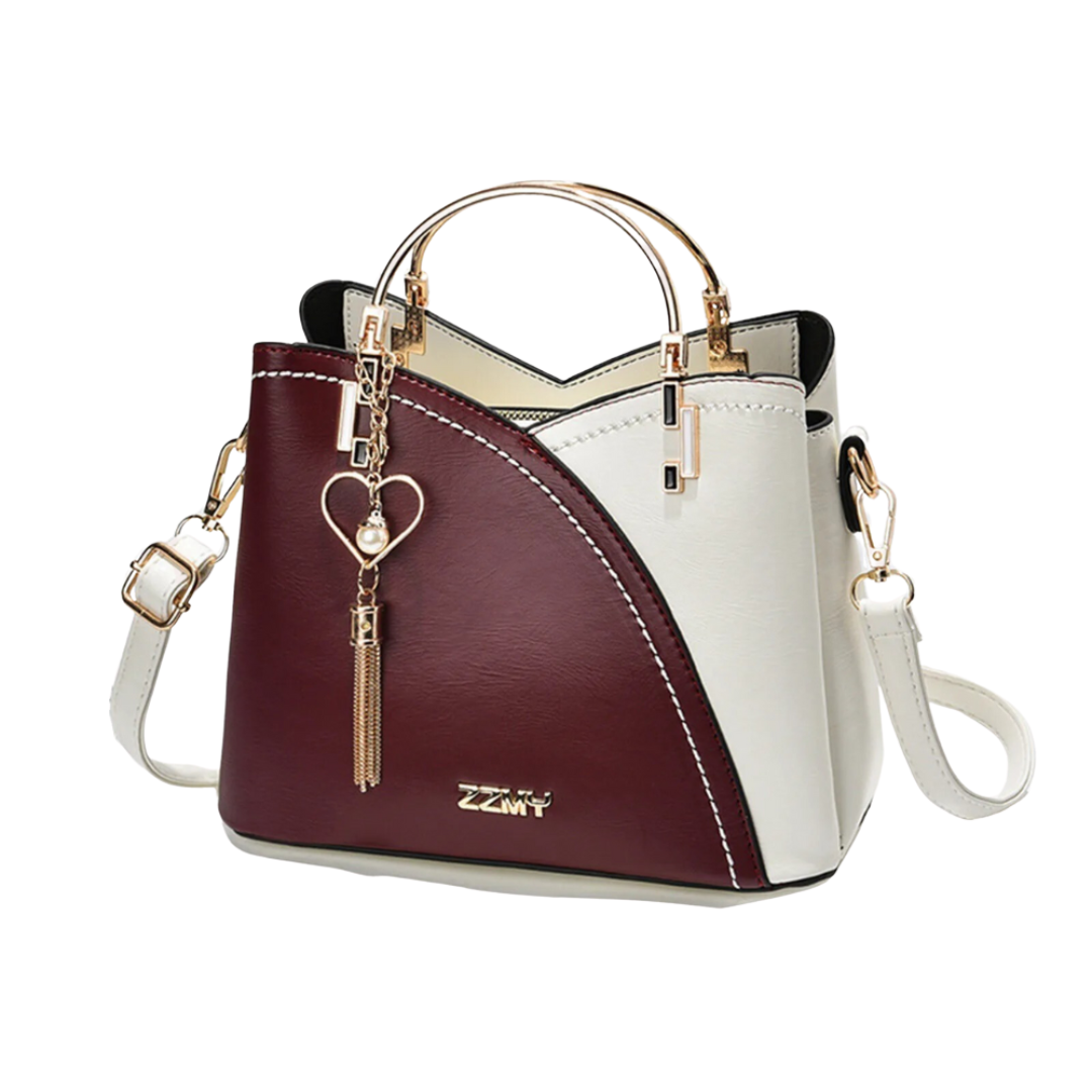 New elegant women's tote bag. Features unique patchwork, a stylish tassel charm & comfortable shoulder strap.