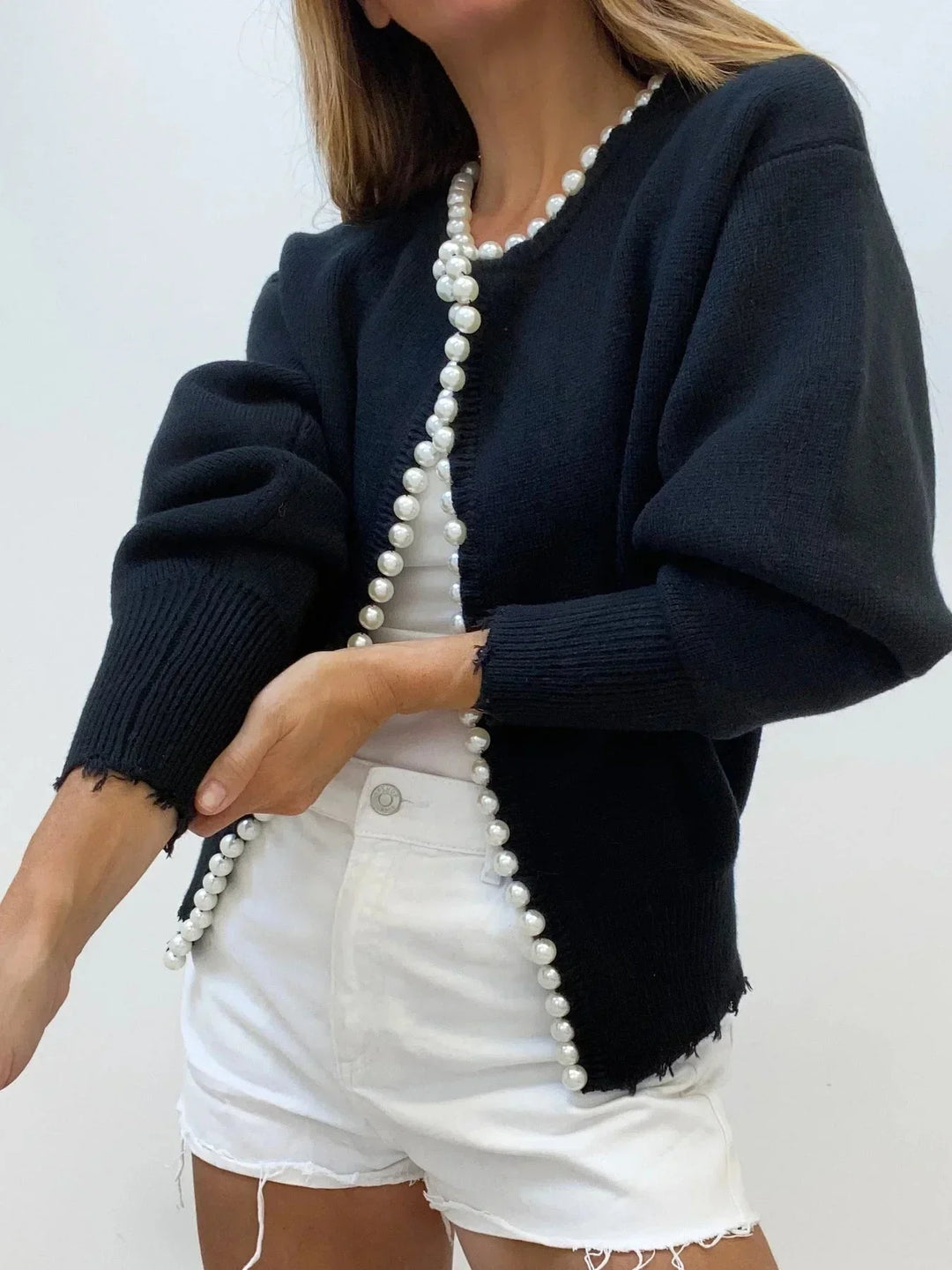 Chic women's knit cardigan with beautiful pearl trim details. Elegant, feminine, & perfect for various occasions.