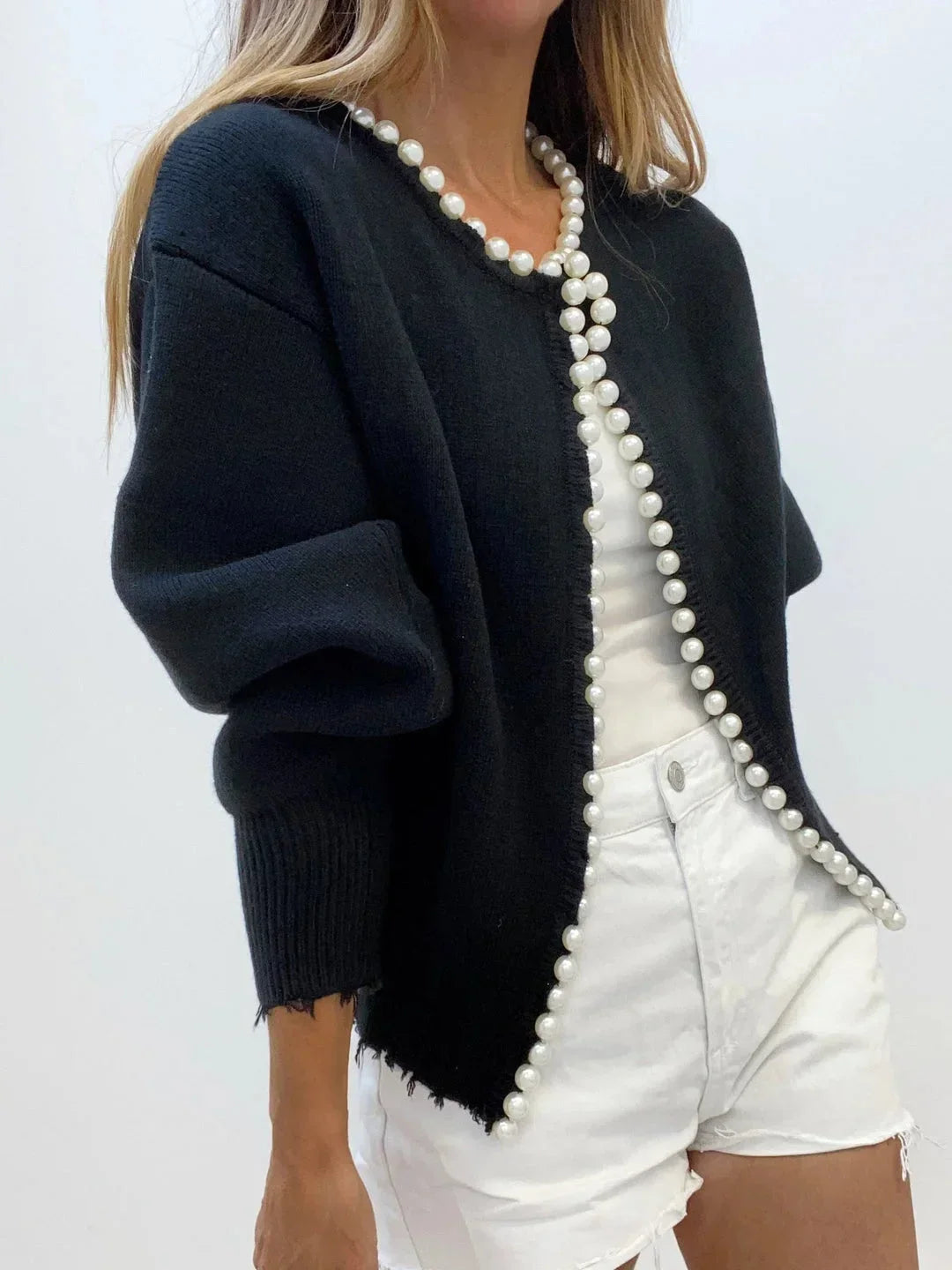 Round neck, long-sleeve women's knit cardigan with pearl trim. A versatile, sophisticated layering piece.