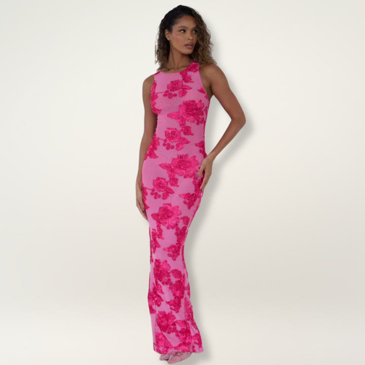 Close-up of elegant pink floral pattern on a high-neck maxi wedding guest dress for women. Ideal for special occasions.