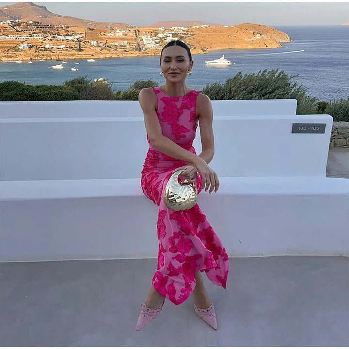 Stunning pink floral high-neck maxi dress for women, designed as an elegant wedding guest or special occasion evening gown.