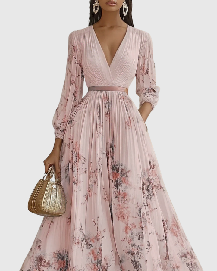 Elegant women's pleated long sleeve maxi dress with a vibrant and eye-catching floral pattern.