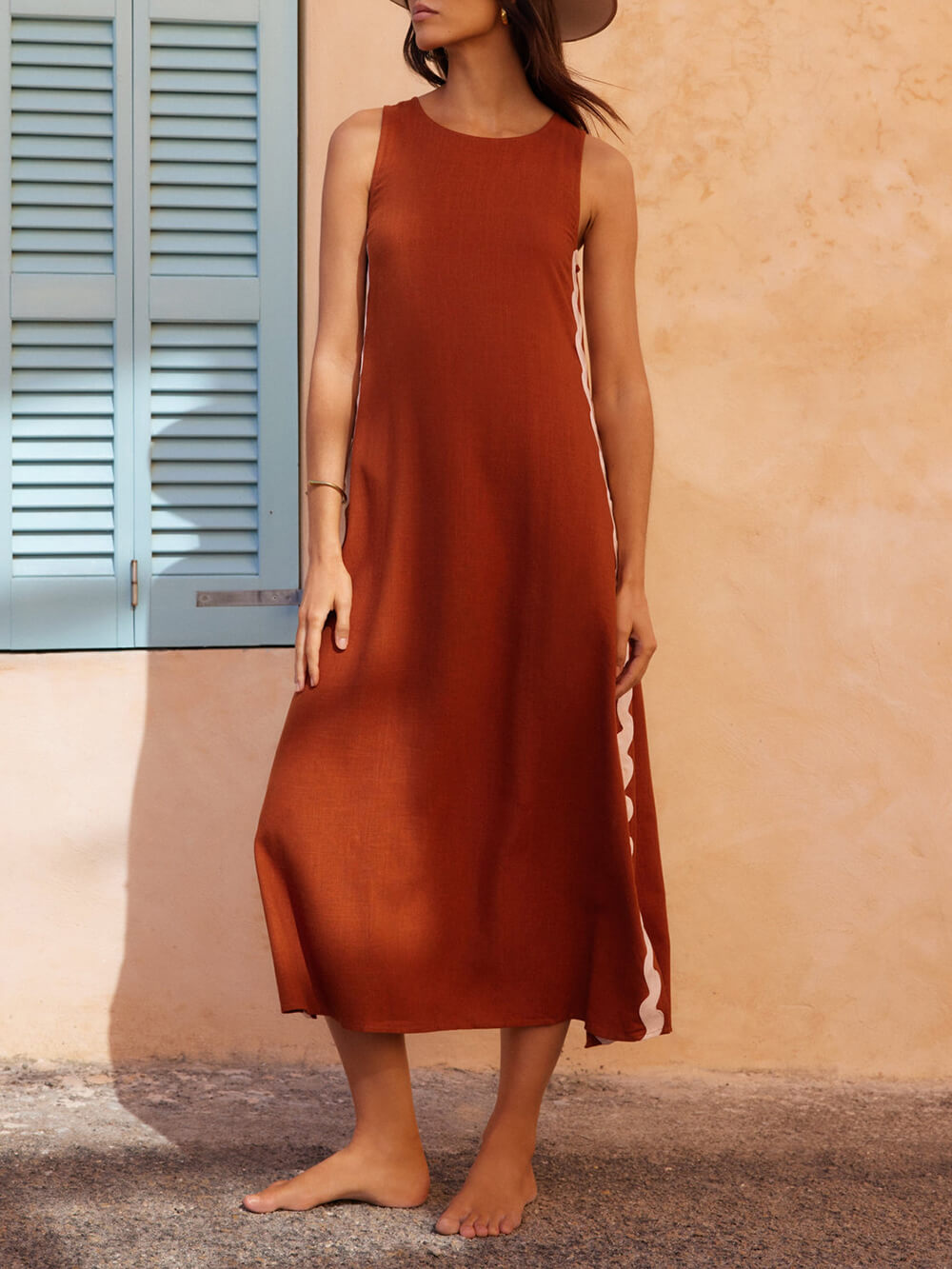 Stylish black women's pleated midi dress with a floral pattern, featuring a comfortable flowy fit.