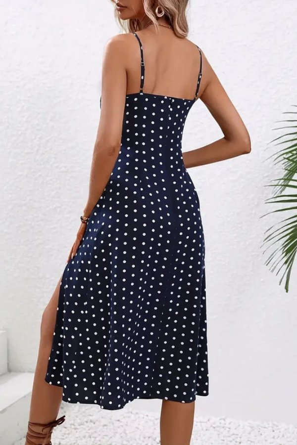 Chic women's halter neck midi dress with elegant pleats, ideal for summer evenings or versatile spring outfits.
