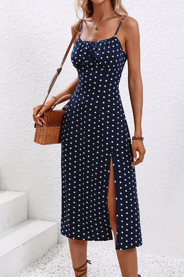 Flowy pleated women's midi dress with a stylish halter neck, offering an elegant look for casual or evening wear.