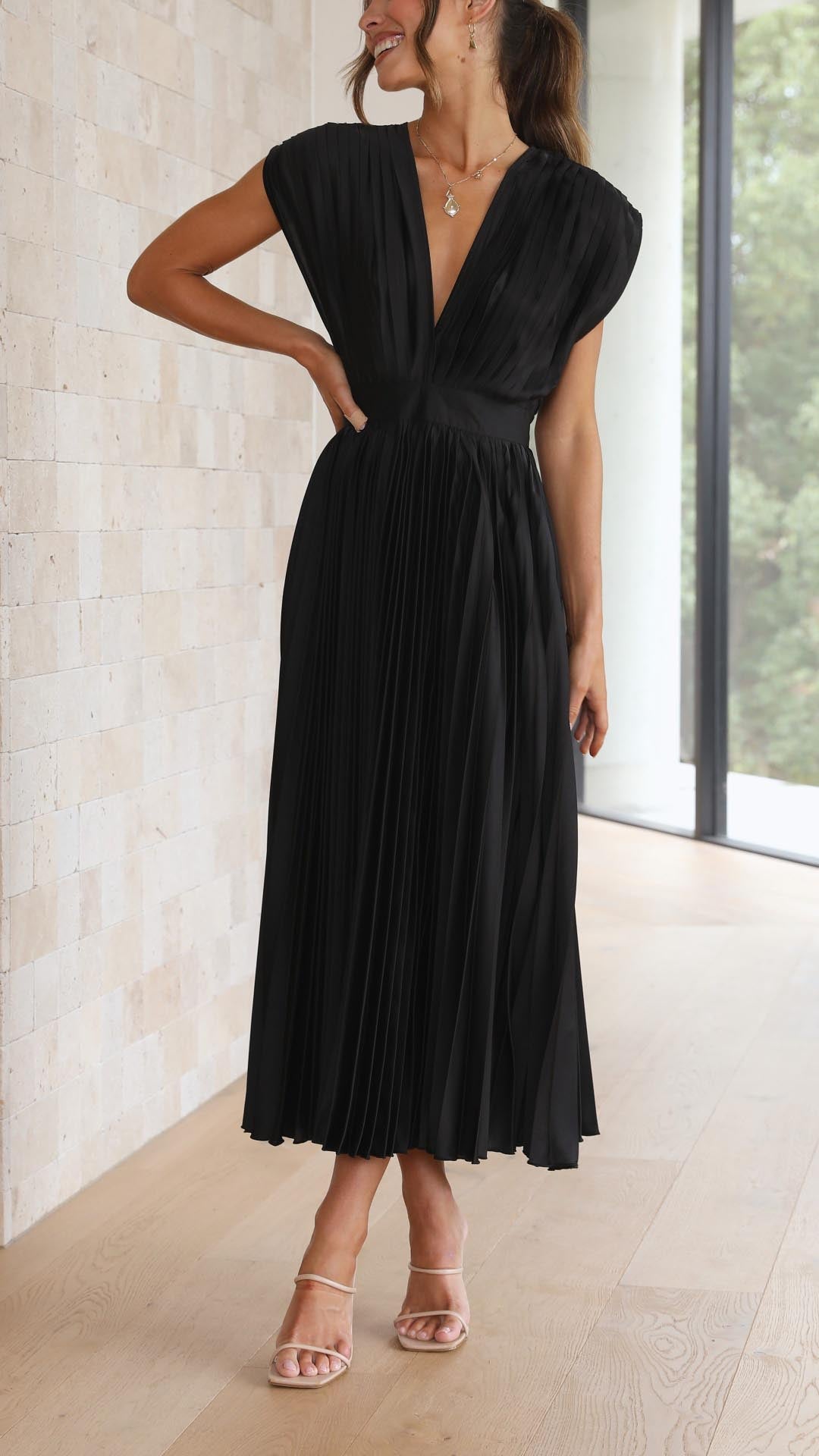 Elegant long pleated evening dress for women, deep V-neck, a sophisticated choice.
