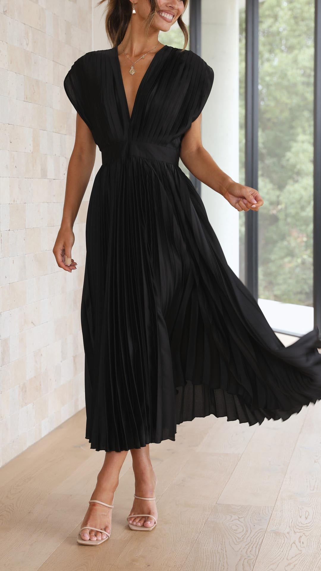 Stylish women's long pleated dress, deep V-neck, ideal for formal occasions & celebrations.