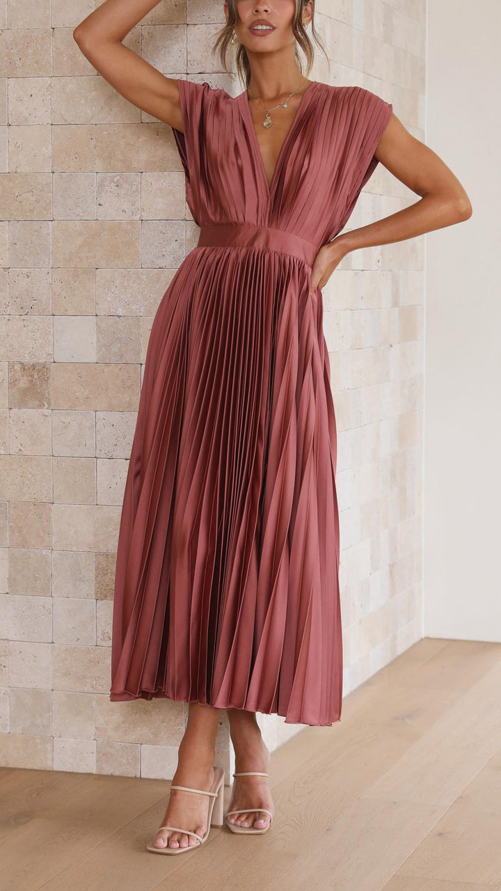 Sophisticated long pleated gown, sleeveless & V-neck, ideal as a wedding guest or cocktail dress.