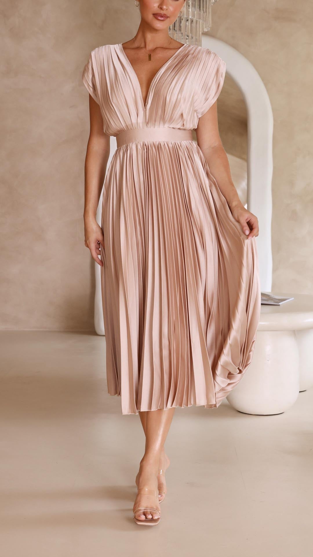 Chic pleated maxi dress with a deep V-neck, elegant for wedding guests or special occasions.