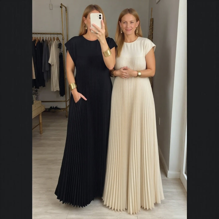 Modern women's pleated maxi dress, a versatile and comfortable flowing style for elegant summer wear.