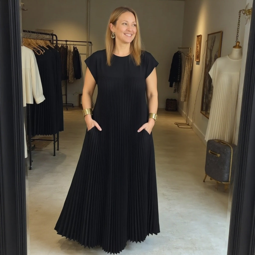 Women's occasion wear: an elegant pleated maxi dress with a comfortable flowing summer style.