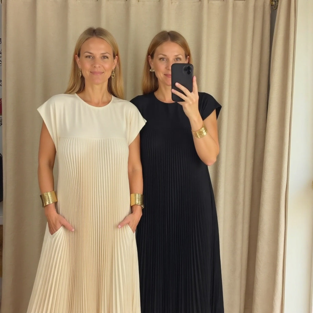 Feminine flowing maxi dress with elegant pleats, offering comfortable versatility for women's summer fashion.