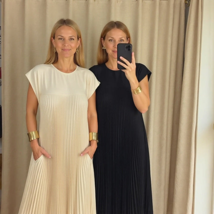 Feminine flowing maxi dress with elegant pleats, offering comfortable versatility for women's summer fashion.