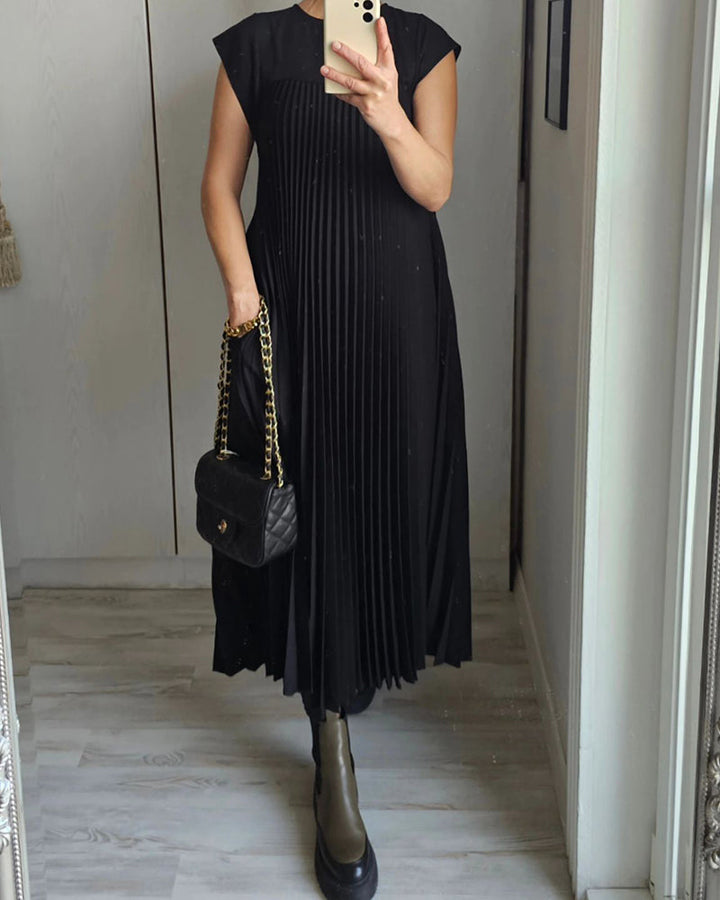 Stylish women's flowing maxi dress, elegantly pleated for comfort, perfect for summer & occasion wear.