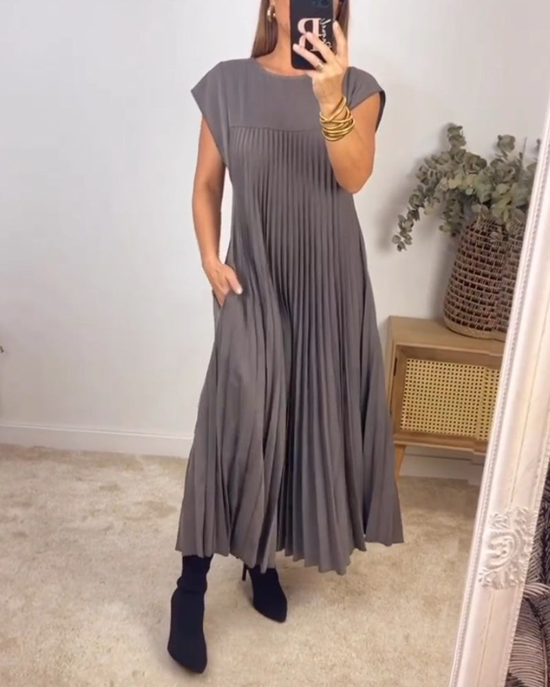 Stylish pleated maxi dress for women, featuring a flowing silhouette & comfortable elegant design.