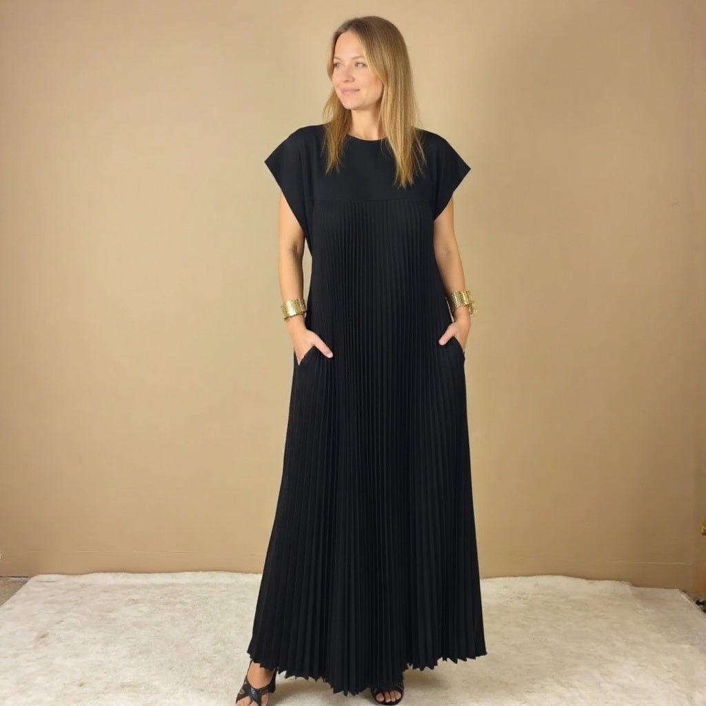 Sophisticated women's flowing maxi dress, featuring elegant pleats & a comfortable long design.