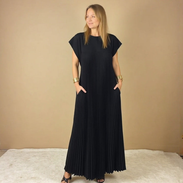 Sophisticated women's flowing maxi dress, featuring elegant pleats & a comfortable long design.