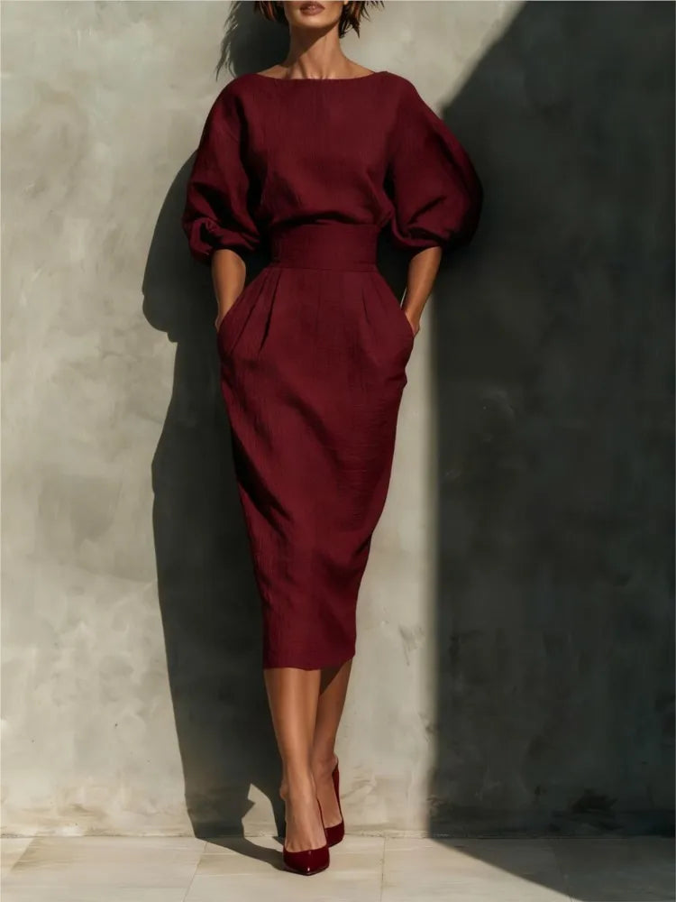Women's pleated midi dress with cinched waist & lantern sleeves. Ideal for spring, summer, or day wear.