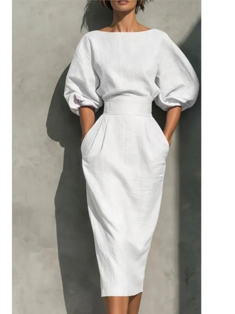 Stylish women's pleated midi dress with flowy lantern sleeves, suitable for formal or casual events.