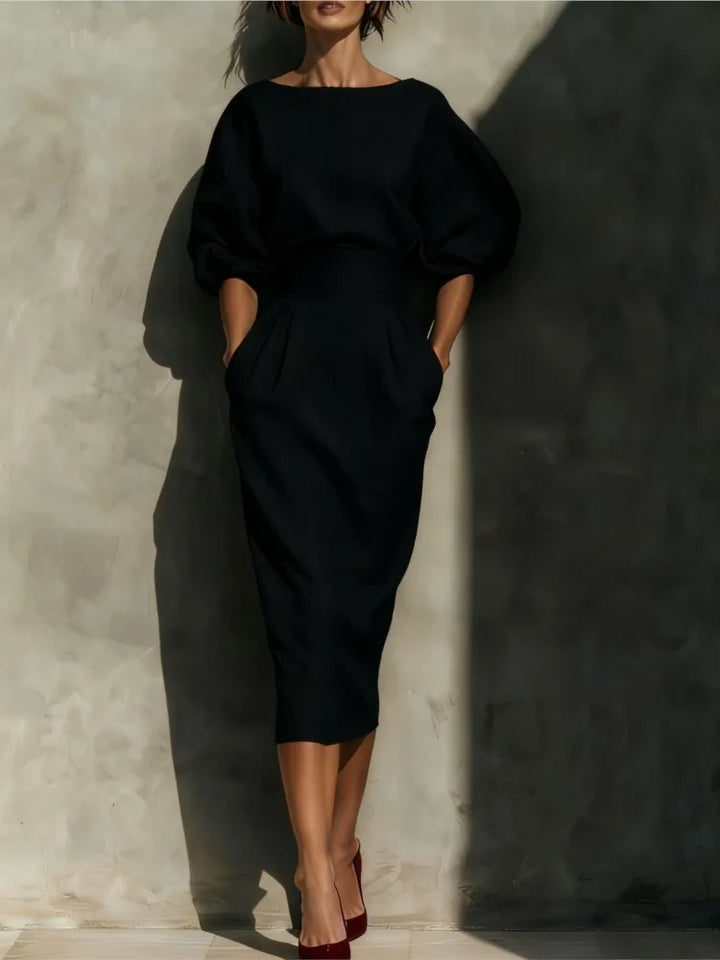 Women's elegant pleated midi dress with lantern sleeves, cinched waist, & practical side pockets.