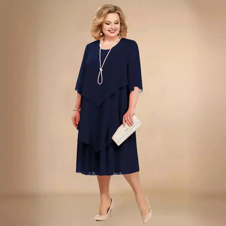 Sophisticated plus size women's asymmetrical midi dress, offering an elegant fit for formal evening wear.