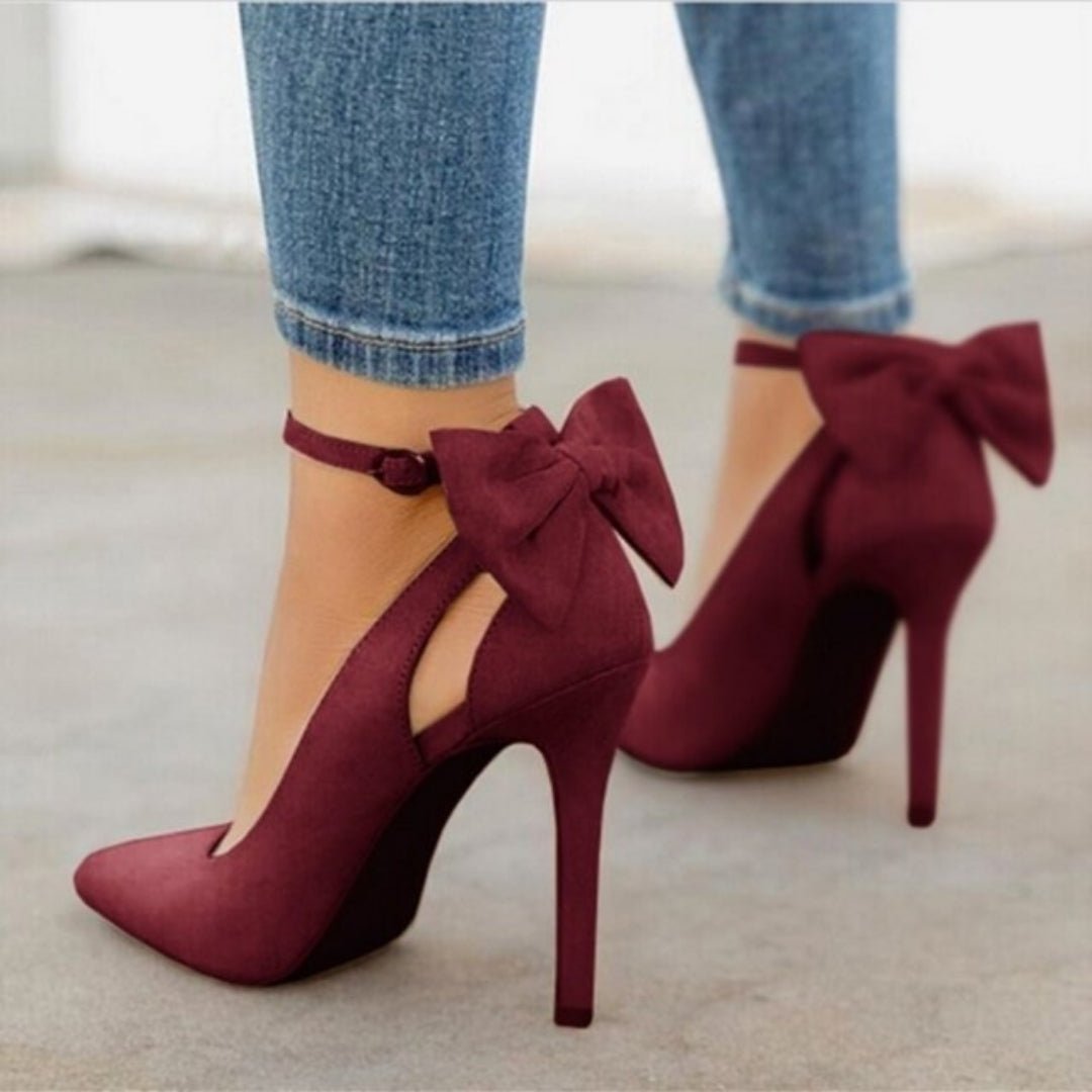 Stylish women's stiletto court shoes, featuring a pointed toe & elegant bow. Ideal for evening wear & special occasions.