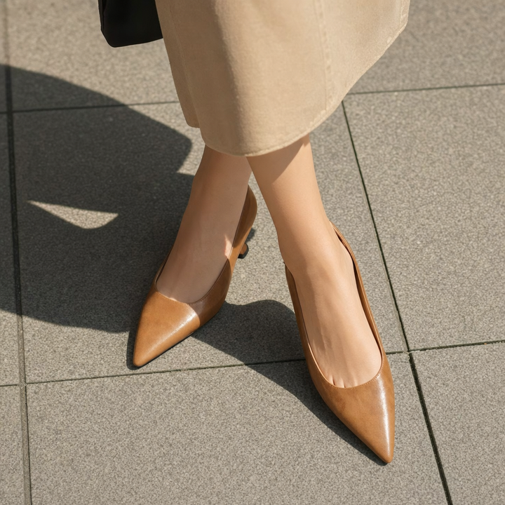Classic black pointed-toe women's dress shoes, slip-on design with a chic thin heel for sophisticated looks.