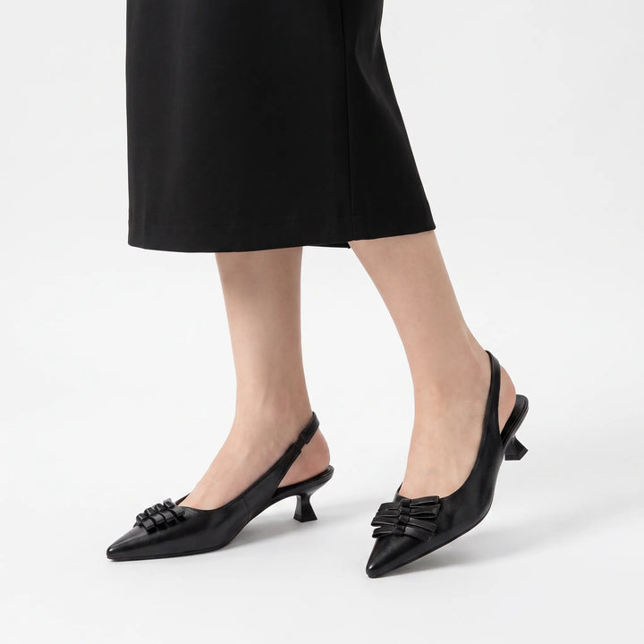 Fashionable women's pointed toe slingback kitten heels, a must-have for evening wear and professional attire.