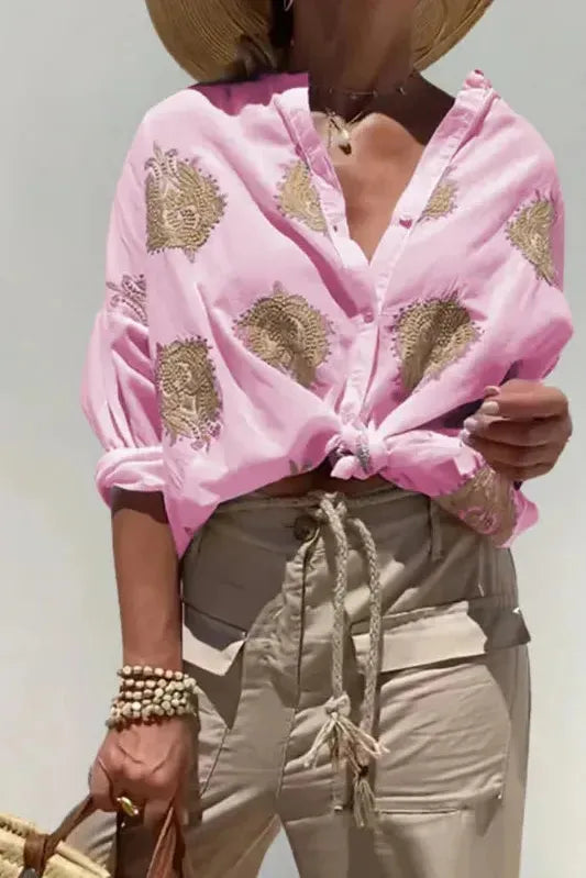 Comfortable women's printed blouse with an elegant design. Versatile shirt for casual or professional style.