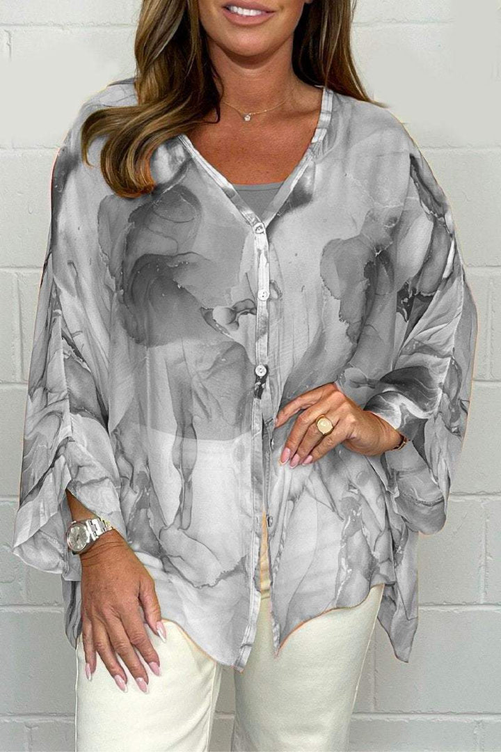Elegant women's printed blouse for spring and summer. Versatile, comfortable, and perfect for casual wear.
