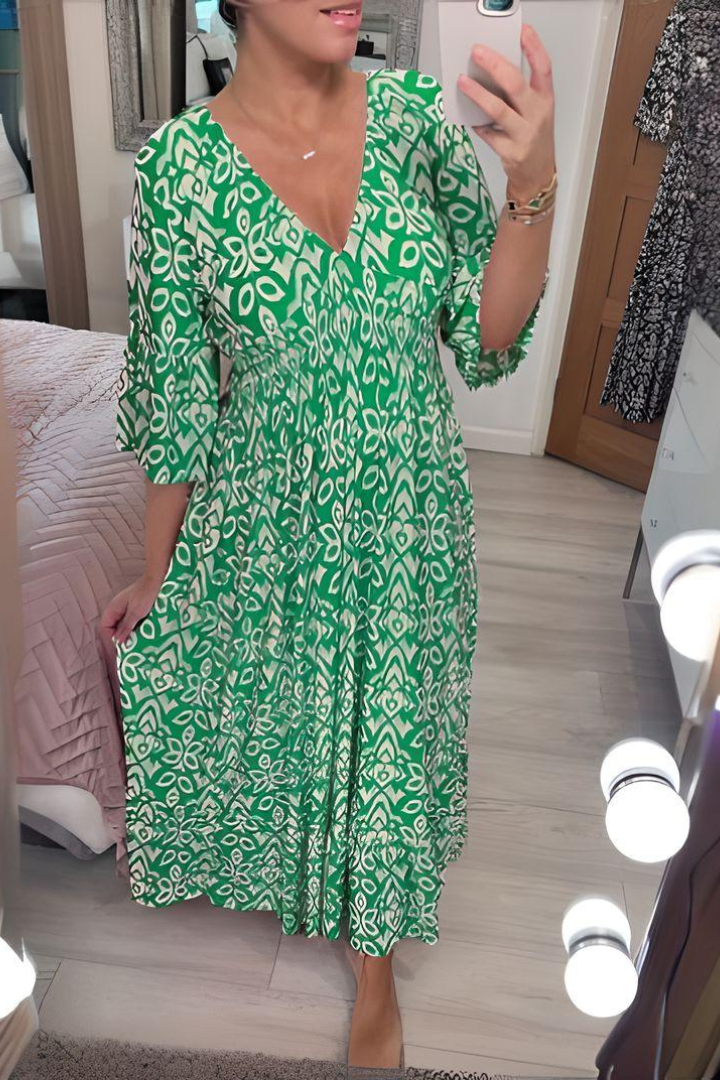 Beautifully printed women's midi dress with a chic belted waist, designed for an elegant spring look.
