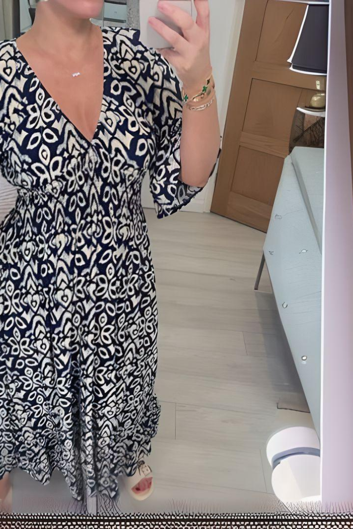 Fashionable women's printed midi dress, comfortable with a belted waist, suitable for spring/summer style.
