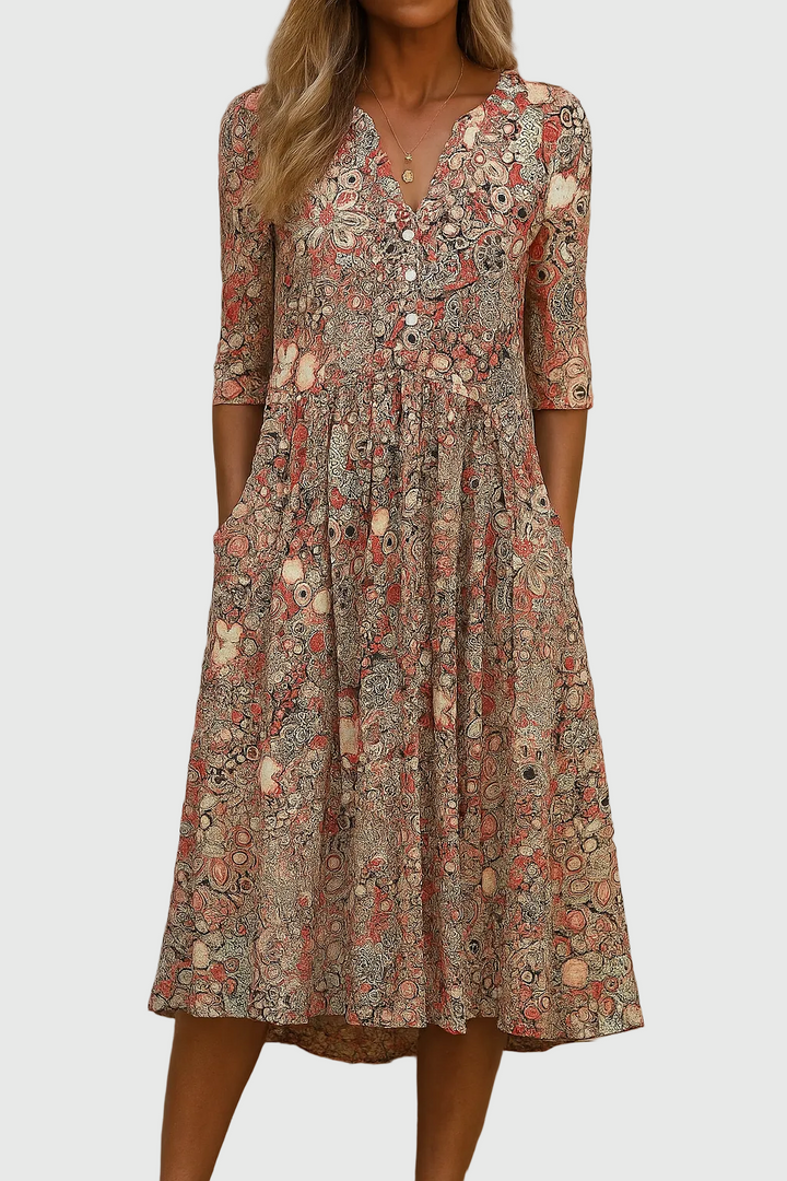 Elegant women's printed midi dress with v-neck and three-quarter sleeves, perfect for spring/summer casual wear.
