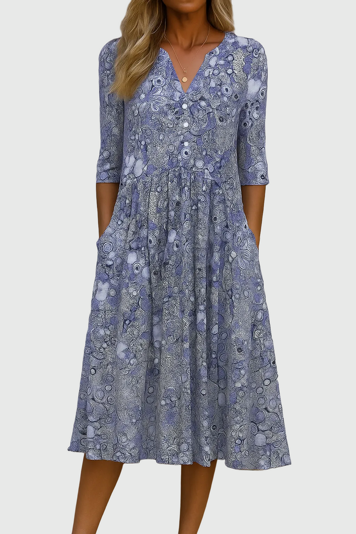 Flowy women's printed midi dress, a stylish v-neck vacation or day dress with three-quarter sleeves.