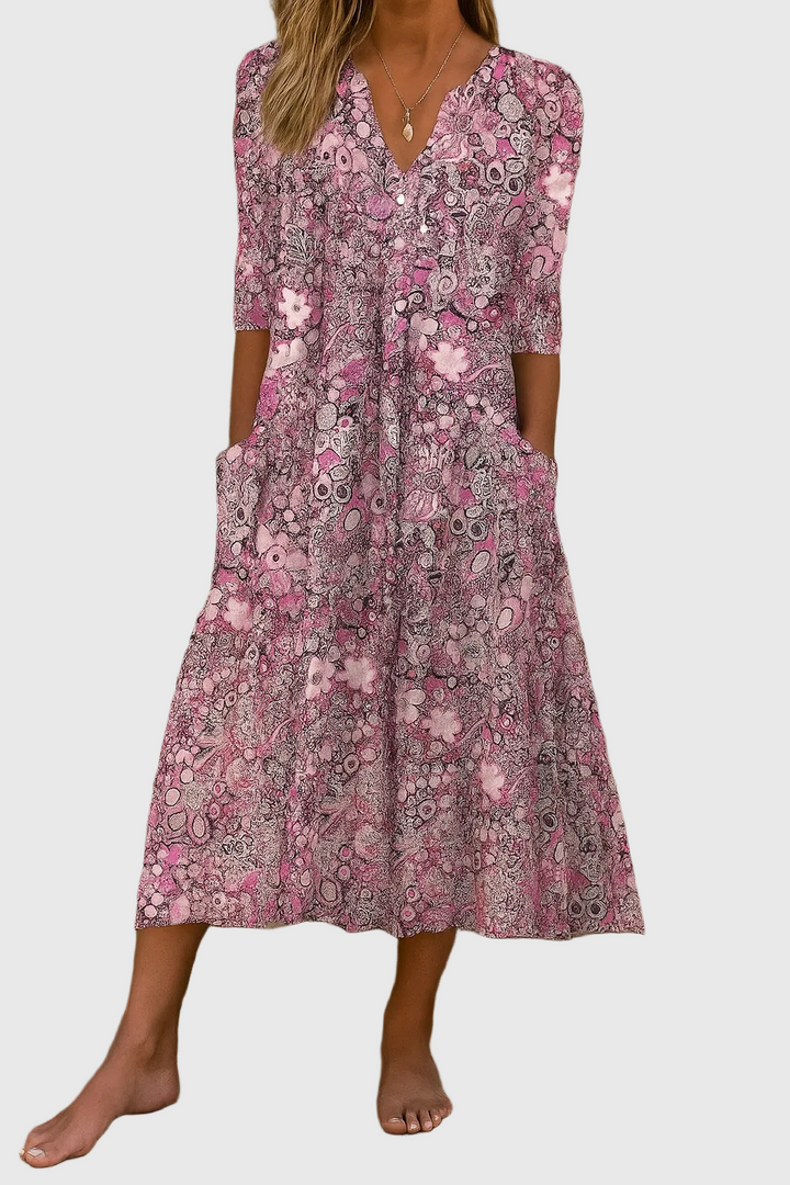 Comfortable casual women's printed midi dress, featuring a flattering v-neck and three-quarter sleeves.