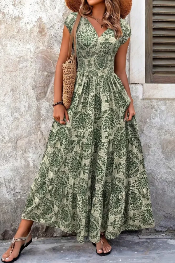 Stylish women's sleeveless V-neck maxi dress with vibrant print, ideal for a comfortable yet elegant summer vacation look.