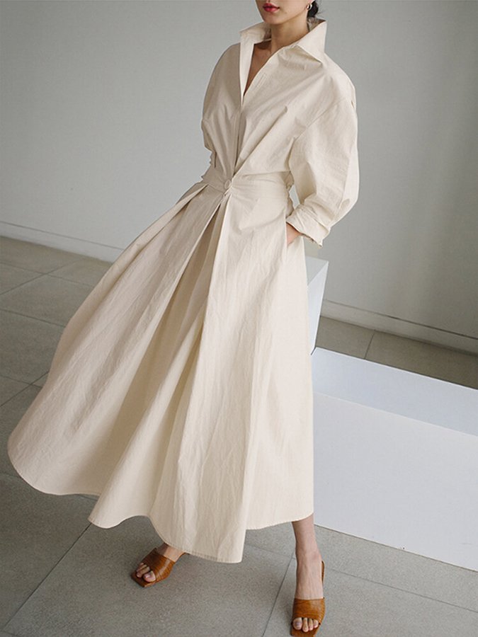 Sophisticated V-neck A-line maxi dress for women, featuring chic puff sleeves and a flattering twist waist.