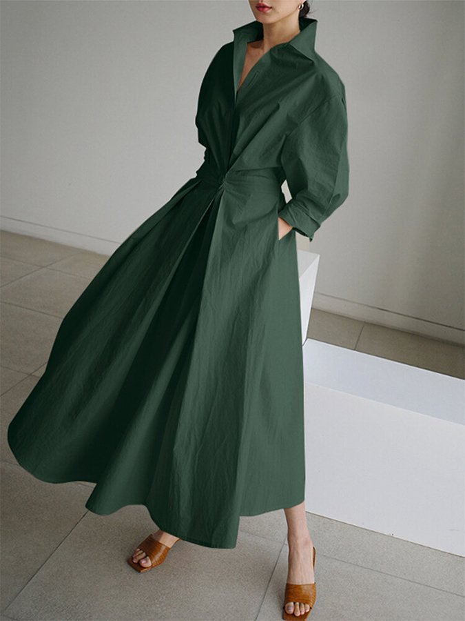 Detail of the elegant puff sleeves and unique twist waist of this women's formal/casual maxi dress.