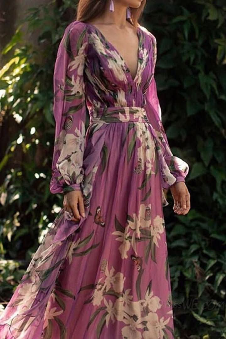 Women's sophisticated purple V-neck maxi dress with long flowing skirt, suitable for formal events or vacation.