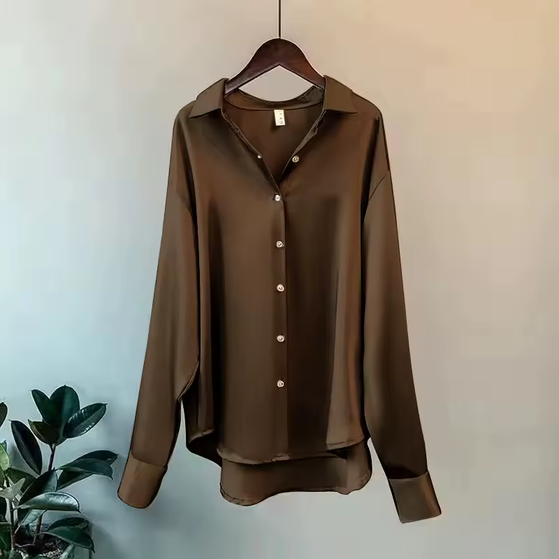 Oversized elegant women's long sleeve button down blouse. Relaxed fit for casual chic or stylish office wear.