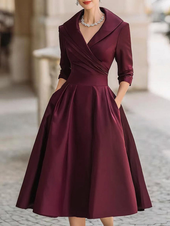 Stylish women's party midi dress in retro style. Features elegant draped collar; perfect for evening cocktails.